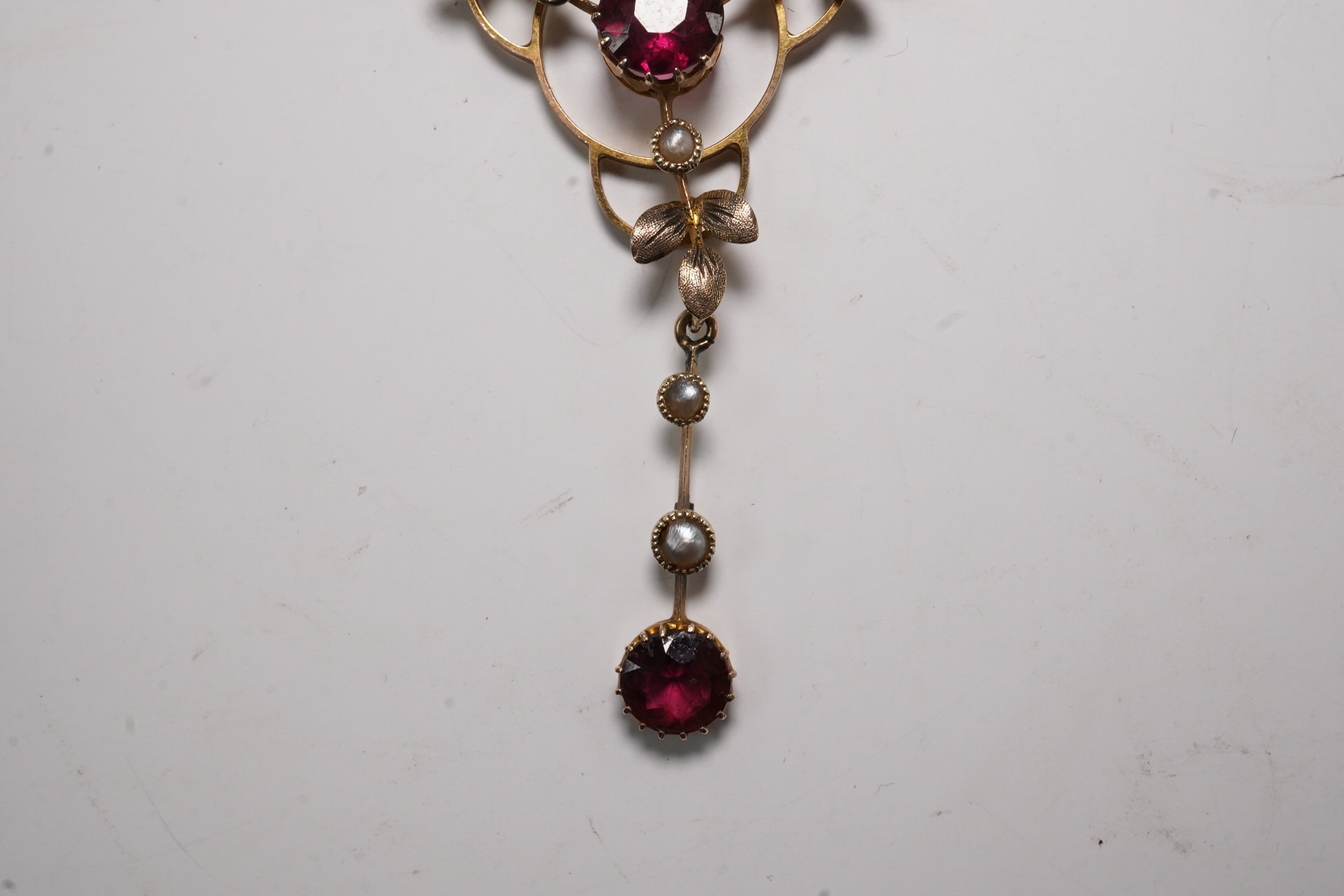 An Edwardian 9ct and gem set drop pendant necklace, pendant 43mm, chain tangled Condition - poor to fair
